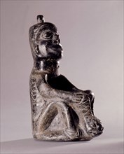 Stone human figure bowl, thought to have been used by Salish shamans in purification rites as part of ceremonies marking the onset of female puberty