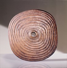 Spindle whorl, used by the Coast Salish during spinning to prevent the wool slipping from the spindle