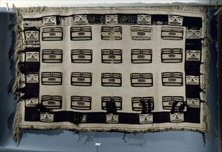 A woven Chilkat blanket which is unusual in that it is made of pure wool and not a mixture of wool and cedar bark