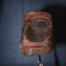 Carved and coloured wooden mask