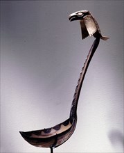 Ladle with a raven perched on the handle