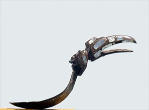Ceremonial spoon with a handle carved in the form of a raven head