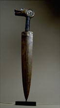 An iron bladed knife carved from the horn of a bighorn sheep and inlaid with iridescent abalone shell