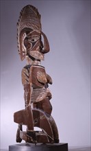 Carved female figure possibly used as a land ownership marker