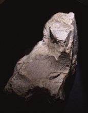 Quartzite flint, may have been modified to suggest the form of a bison