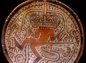Elegant and typically Cocle style of polychrome ceramic plate, depicting dancing jaguar, crocodile, or supernatural creature, or even a shaman wearing a mask