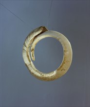 An arm band made from a boar tusk