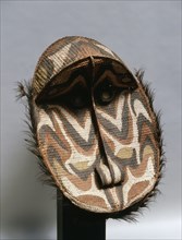 These large circular basketry masks represent female clan specific spirits and are hung inside the village mens meeting house to protect the clan members