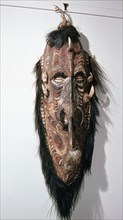 Large shield shaped mask that represents a female clan specific spirit