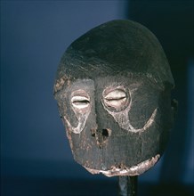 Head of a wooden figure, with inset shell eyes