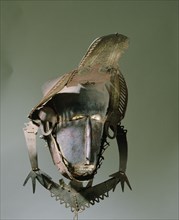 Torres Straits dance mask made from thin sheets of tortoise shell sewn together with palm fibres