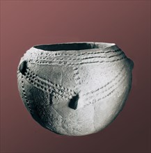 Large globural vessel with punctured designs