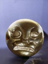 Gold bead in the form of a snarling feline (possibly a jaguar) face