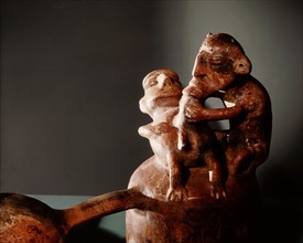 Double chambered ceramic vessel depicting an act of homosexual fellatio