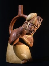 Stirrup spouted Mochica portrait jar depicting a noble pouring out water or chicha beer, probably as a libation associated with fertility rituals
