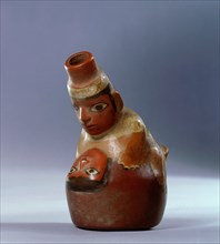 Polychrome Nazca effigy jar showing a couple in the act of sexual intercourse