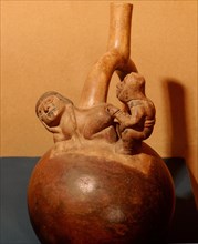 Stirrup spouted vessel depicting a copulating couple
