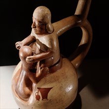 Stirrup spouted vessel depicting fellatio