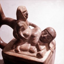 Stirrup spouted vessel depicting  copulating couple