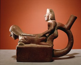 Stirrup spouted vessel depicting a copulating couple