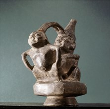 Stirrup spouted vessel depicting  copulating couple