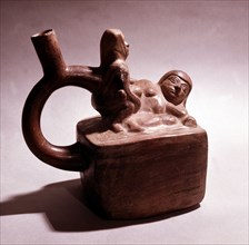 Stirrup spouted vessel depicting  copulating couple