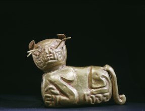 Rare Chavin gold pendant depicting a seated feline