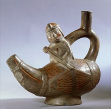Stirrup spouted effigy showing a Mochica fisherman paddling a small totora reed boat