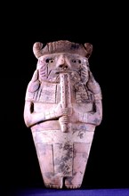 Hollow ceramic effigy flute player wearing jaguar headdress