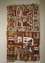 A small fragment of an early Peruvian embroidered textile, probably from the Paracas culture