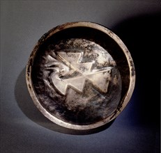 This silver dish, with an Inca geometric design, comes from Ica on the South Coast of Peru
