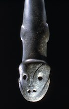 Taino stone ceremonial axe with schematic animal head on handle