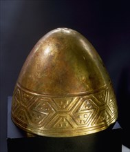 A gold cup in the form of a female breast