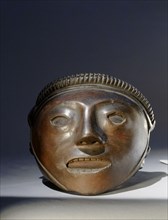 A vase in the form of a trophy head