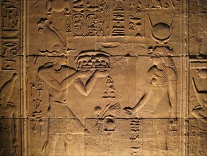 Relief from the inner sanctum of the temple of Isis depicting a pharaoh offiering gifts to the goddess
