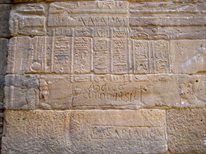 Egyptian hieroglyphic inscription on a wall of the Temple of Isis, defaced by 19th century, traveller explorer graffiti