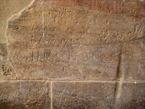 Graffito on a wall of the Temple of Isis reading H
