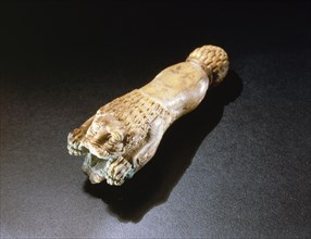 Phoenician ivory dagger handle in the form of a lion