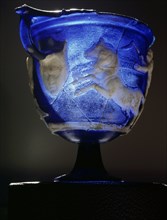 Rare Roman blue glass cameo carved skyphos depicting a scene from a Greek chariot race