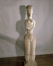 A full length statue of a woman by Modigliani