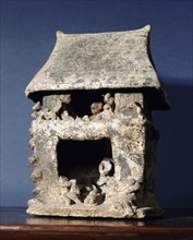Miniature clay mortuary house associated with shamanistic rituals