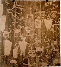 Petroglyphs depicting shamans and sheep