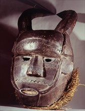 A rare metal appliqued example of a Temne mask known as Ta Bemba that calls at each house in the village to collect boys, leading them to the bush circumcision / initiation camp