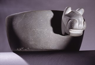 Carved stone bowl with feline head decoration