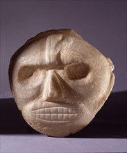 Taino stone maskett thought to represent stylized portrait of a cacique or noble