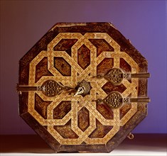 A wood and ivory casket with bronze hinges and geometrical pattern inlaid with ivory and wood