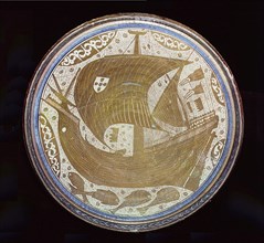 A porcelain lustreware bowl made by Mudejar potters of Manises, Valencia for Christians