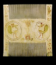 An ivory comb with painted decoration which was made by Sicilian Muslims for Christian patrons