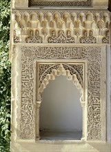 Elaborately carved niche with calligraphic and other stucco decoration