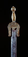 A very rare ceremonial iron sword with brass pommel
